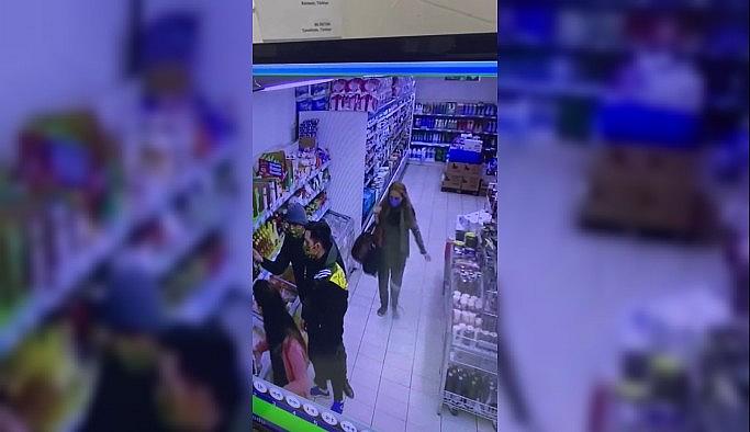 (Özel) Markette kadın şahsın kaşla göz arasında telefon çaldığı anlar kamerada